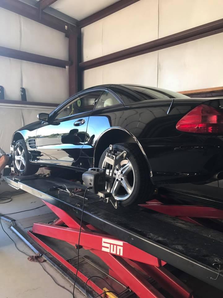 Black car on lift